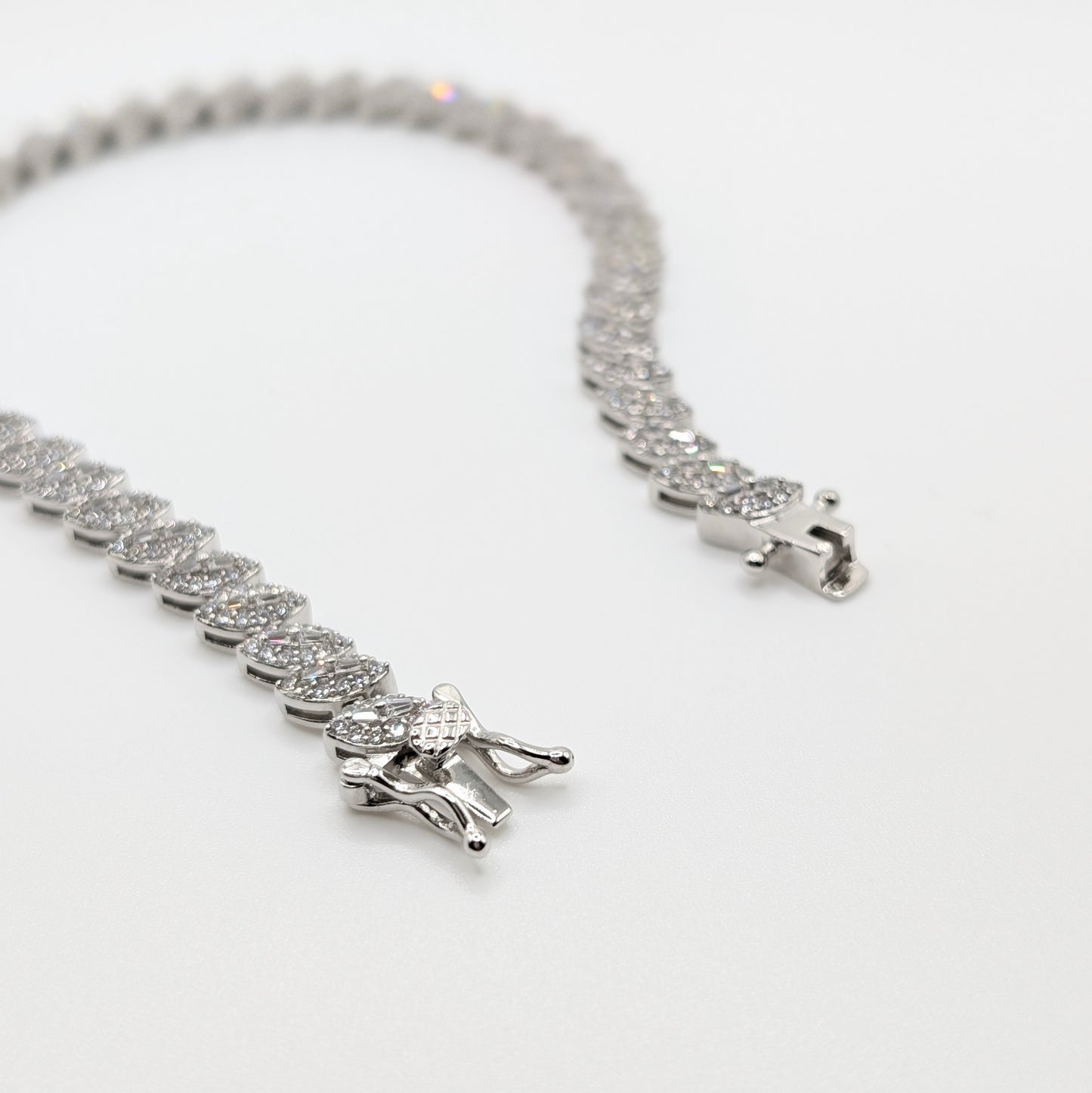 925 sterling silver tennis bracelet paved with small marquise cut zircon stones.