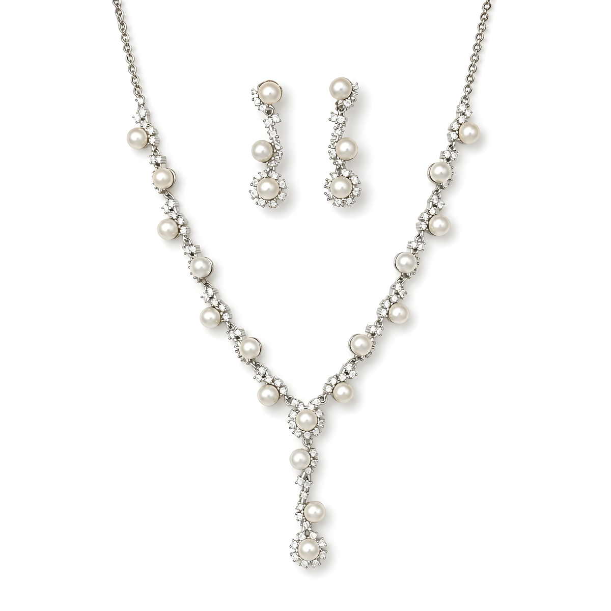 A pearl and cubic zirconia jewelry set featuring a silver-tone Y-necklace, matching drop earrings, and a delicate chain necklace.