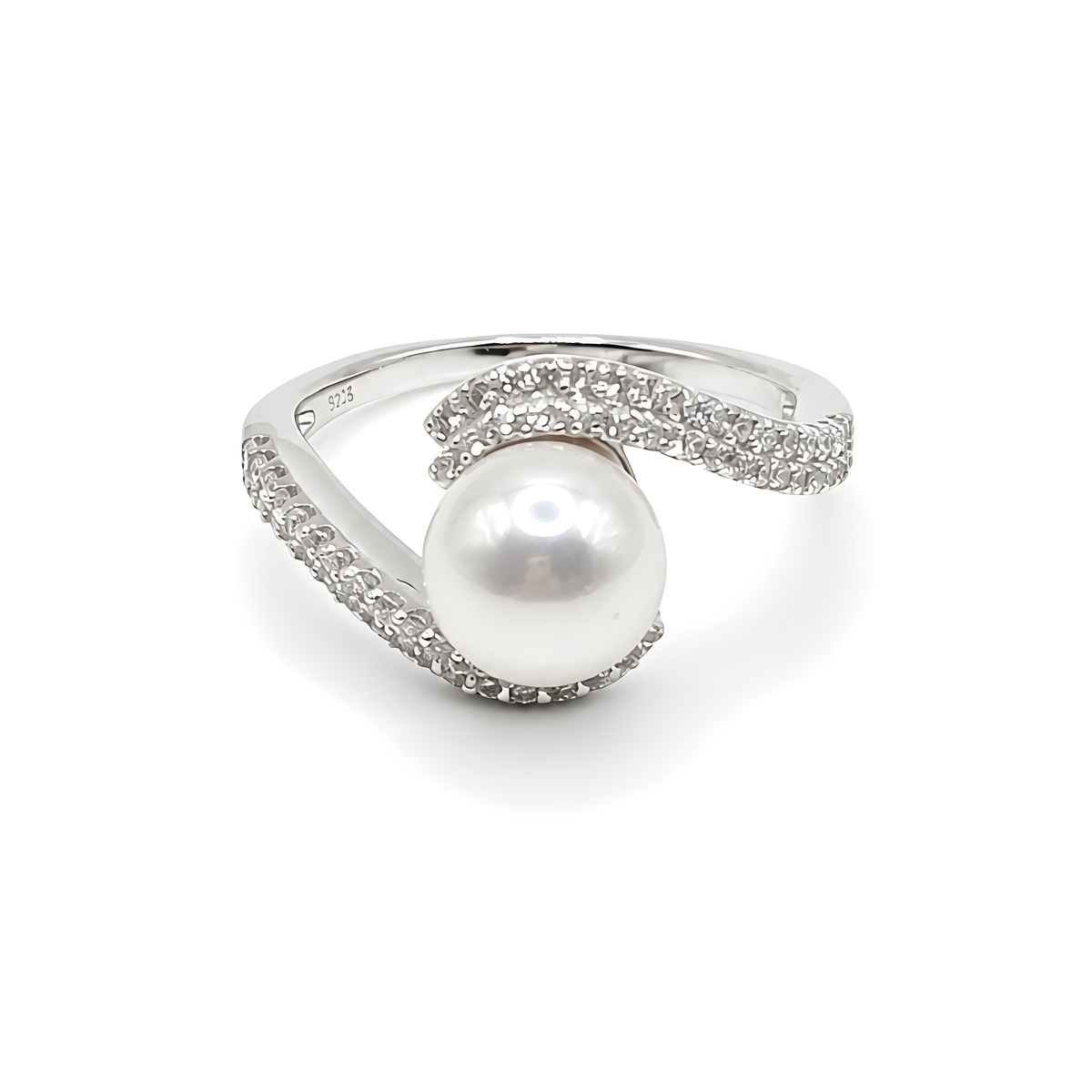 A silver ring featuring a large white pearl surrounded by pavé-set clear stones, with a curved silver band also accented by small clear zirconia.