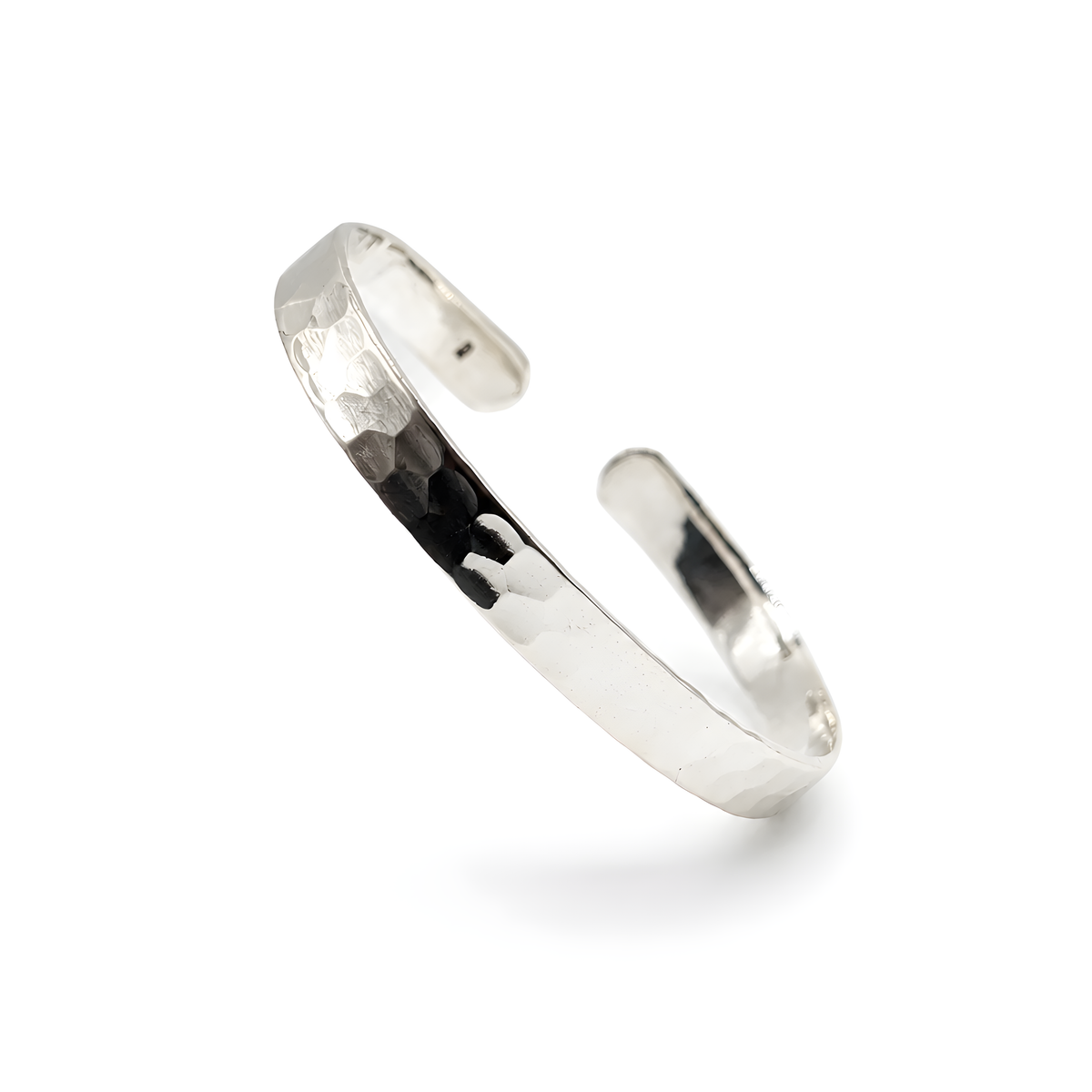 A polished silver open cuff bracelet with a hammered texture on one side and a smooth finish on the other.