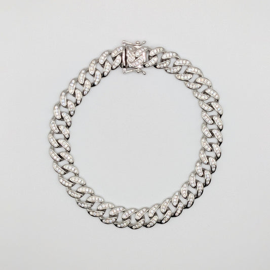 Sterling Silver Iced Curb Cuban Chain Bracelet with brilliant mini Zircon Stones embedded on it.
