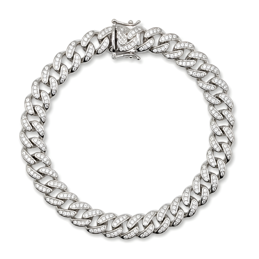 A silver-toned Cuban link chain bracelet paved with small cubic zirconia stones.