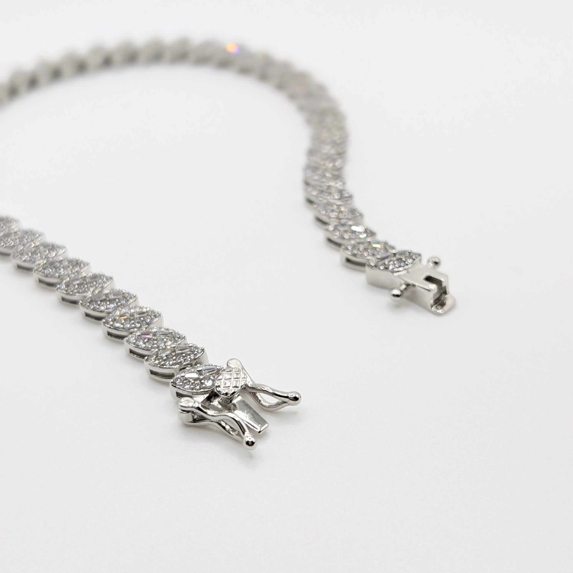925 sterling silver tennis bracelet paved with small marquise cut zircon stones.