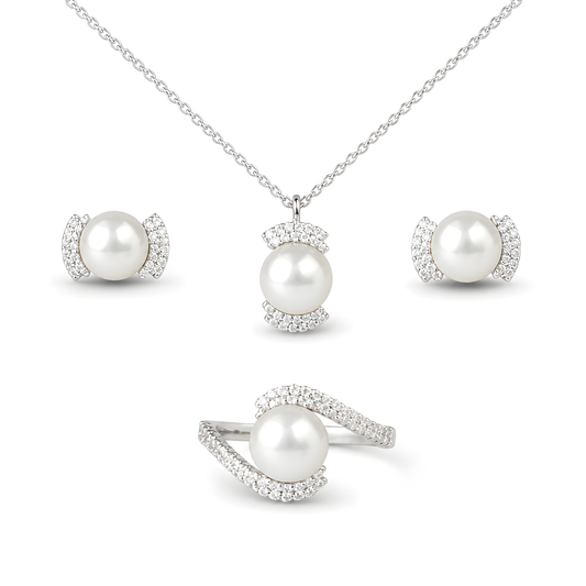 A four-piece pearl jewelry set featuring a pendant necklace, two matching stud earrings, and a ring, all in silver with clear pavé stones. 