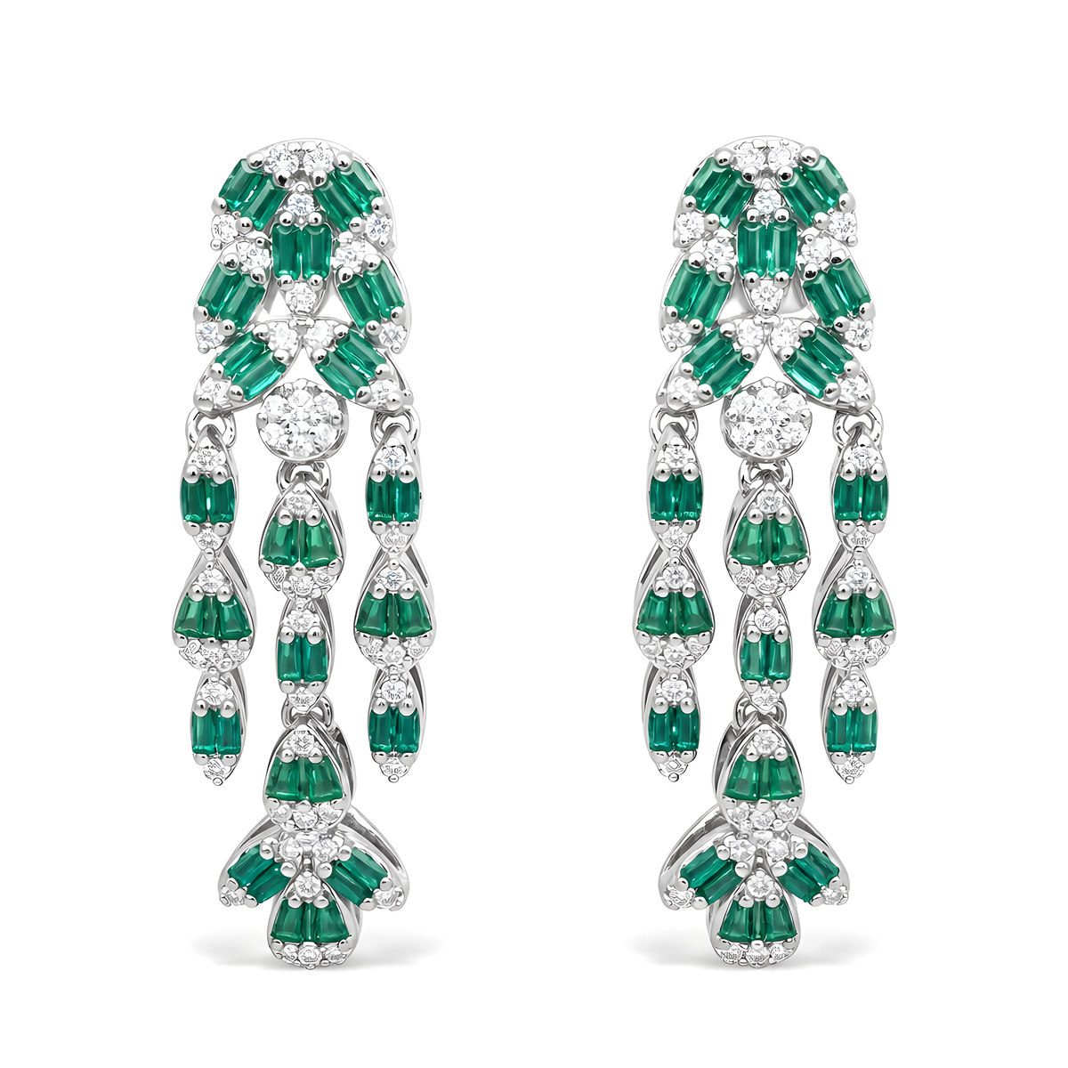 A pair of elaborate drop earrings featuring baguette emerald-cut green cubic zirconia and round clear stones in sterling silver.