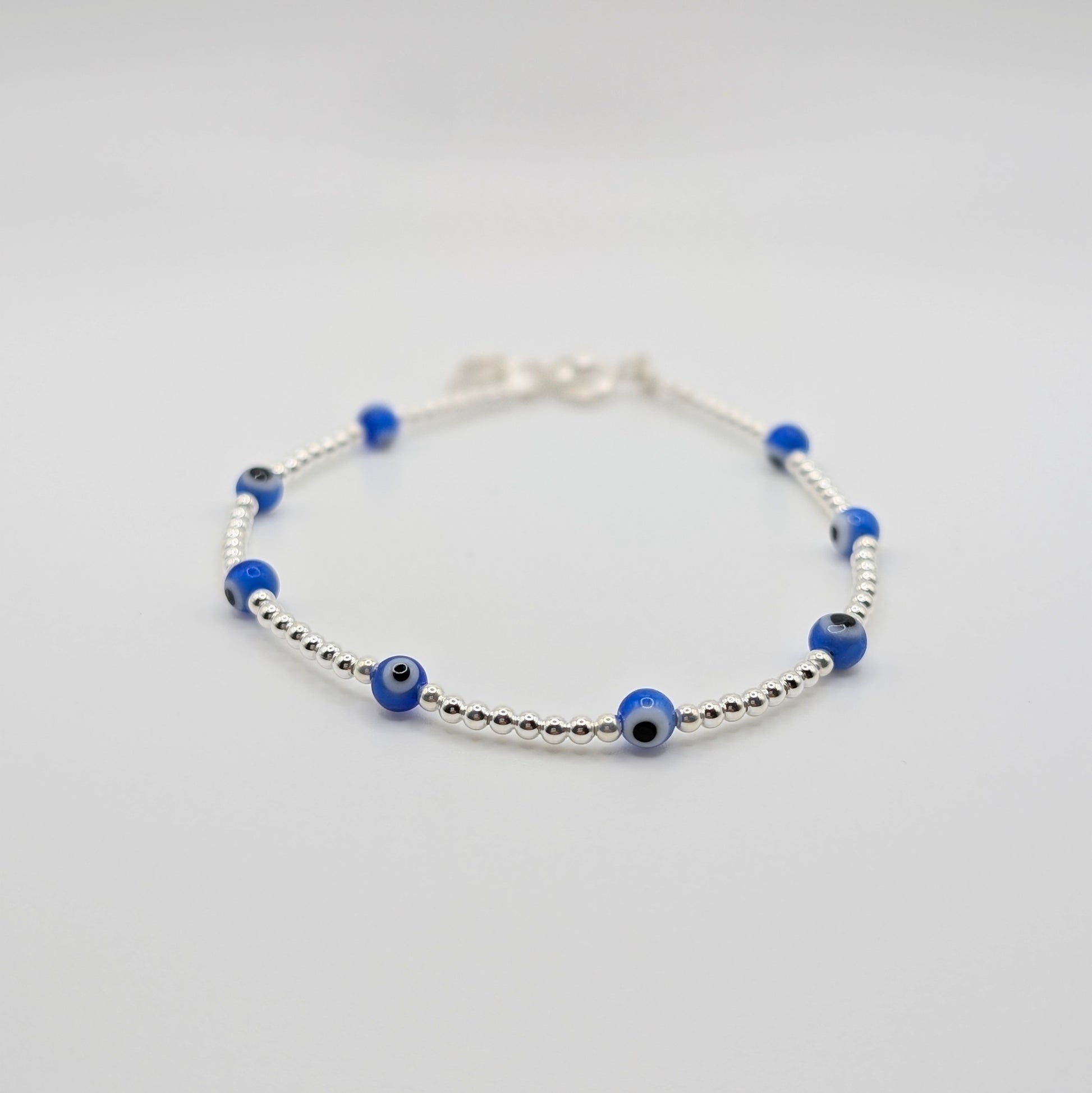 Handmade 925 Sterling Silver Evil Eye Bracelet with silver beads.