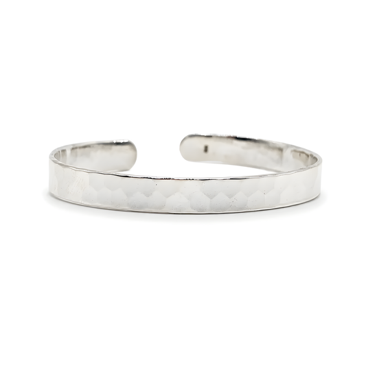 A sterling silver hammered metal cuff bracelet.