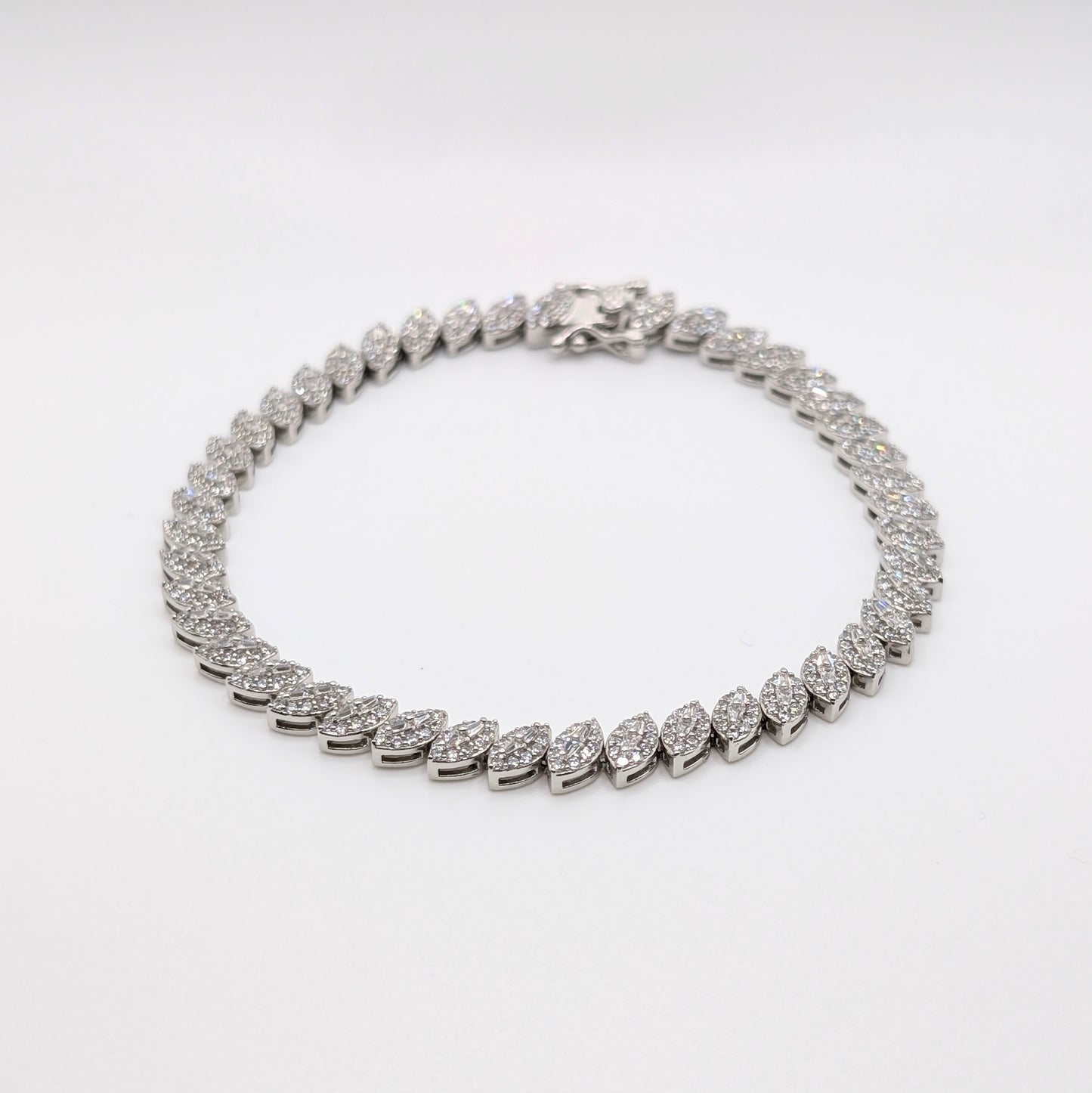 925 sterling silver tennis bracelet paved with small marquise cut zircon stones.