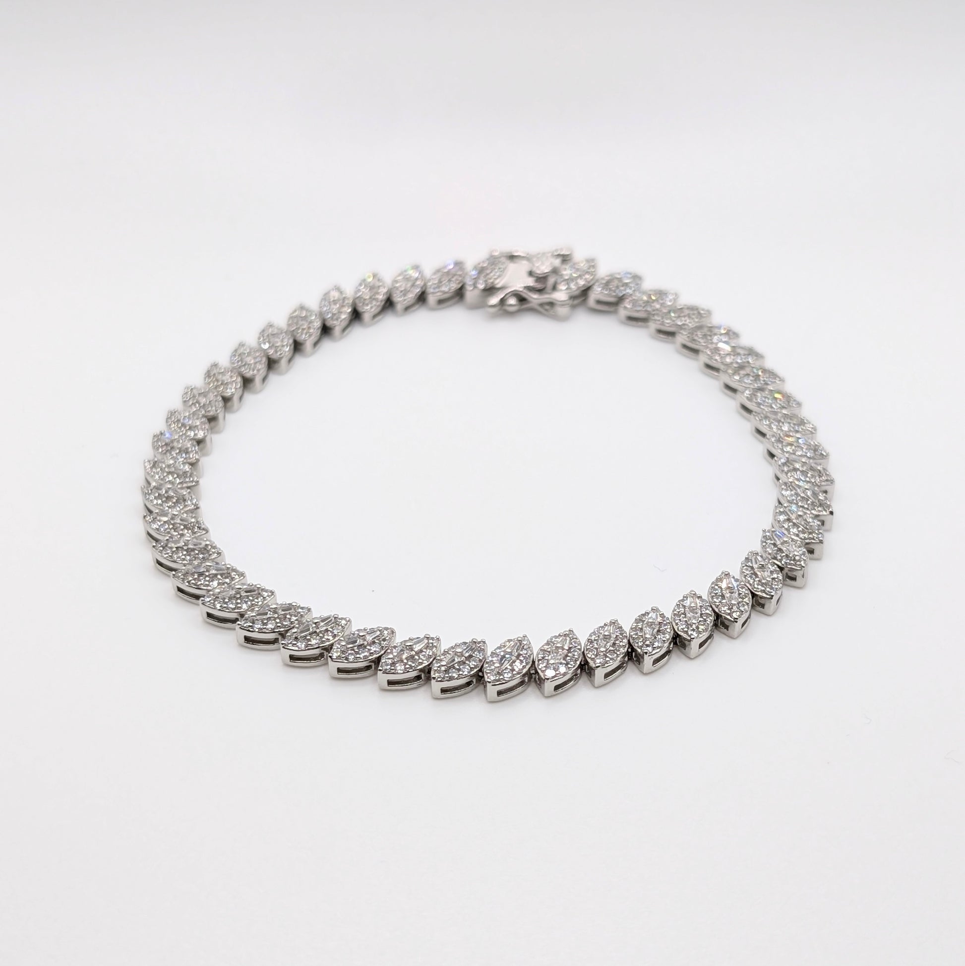 925 sterling silver tennis bracelet paved with small marquise cut zircon stones.
