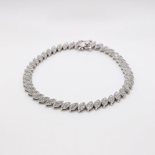 925 sterling silver tennis bracelet paved with small marquise cut zircon stones.