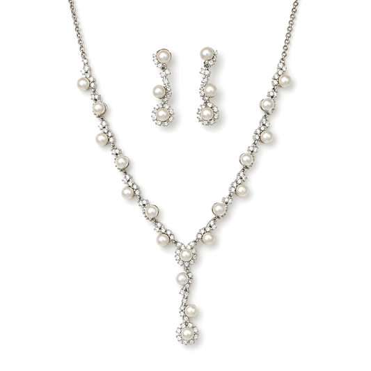 A pearl and cubic zirconia jewelry set featuring a silver-tone Y-necklace, matching drop earrings, and a delicate chain necklace.