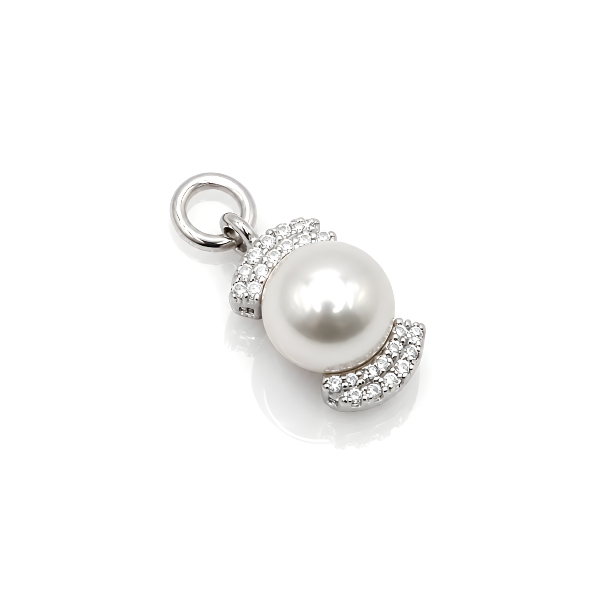 A silver pendant charm featuring a large, lustrous white pearl surrounded by pavé-set clear crystals, with a polished silver bail at the top.