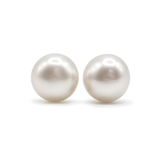 A pair of round white freshwater pearls stud earrings.