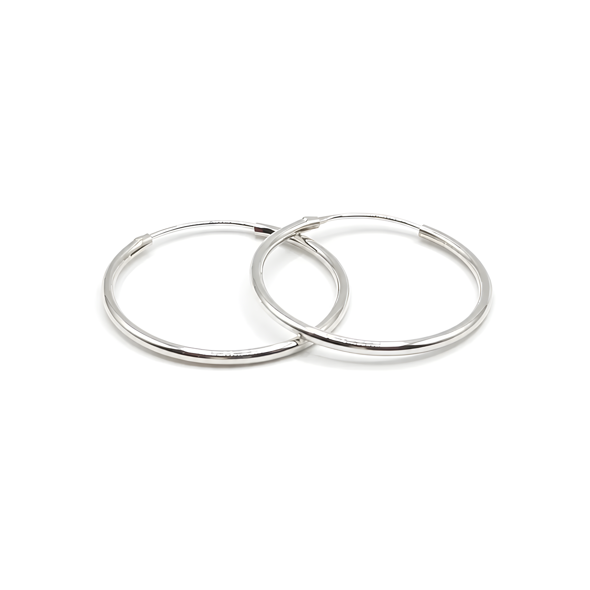 Two polished sterling silver 1" hoop earrings.
