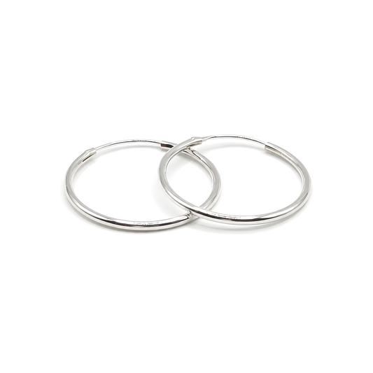 Two polished sterling silver 1" hoop earrings.