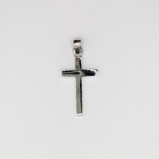A polished silver cross pendant with a flat, textured surface and a top bail.