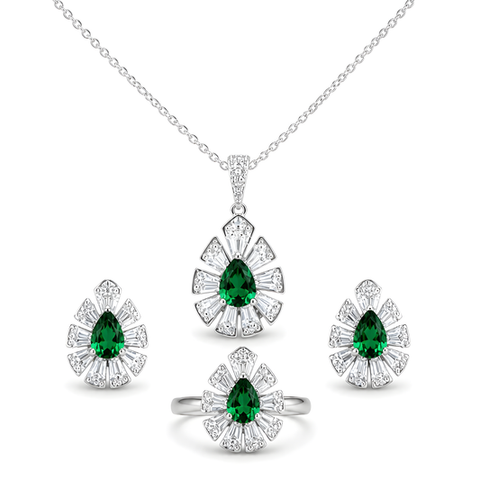 A silver jewelry set featuring a pendant necklace, ring, and two matching earrings, each with a green teardrop zirconia surrounded by clear stones in a floral burst.