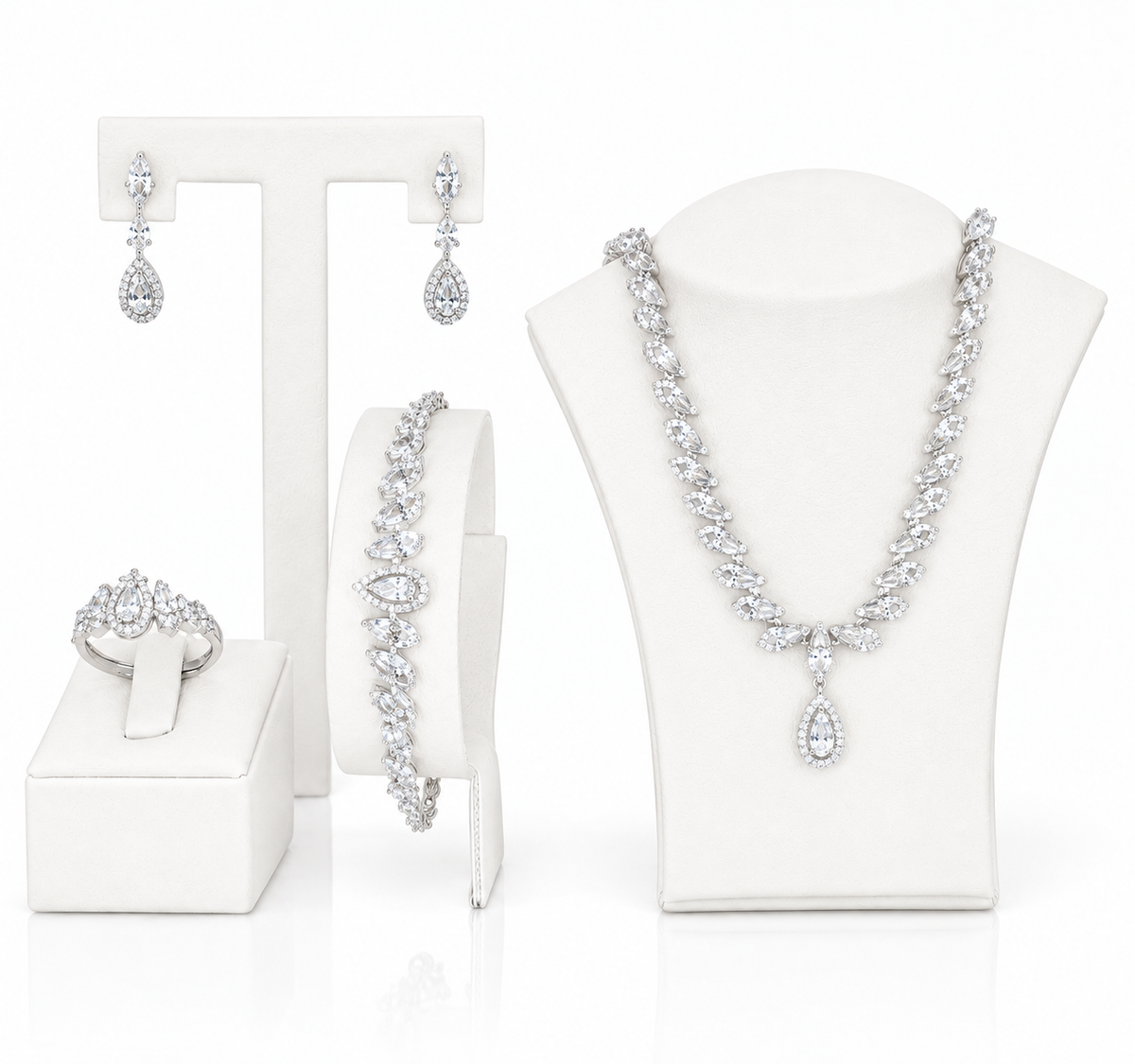A cubic zircon jewelry set, including a necklace, bracelet, earrings, and ring, all featuring sparkling clear gemstones.