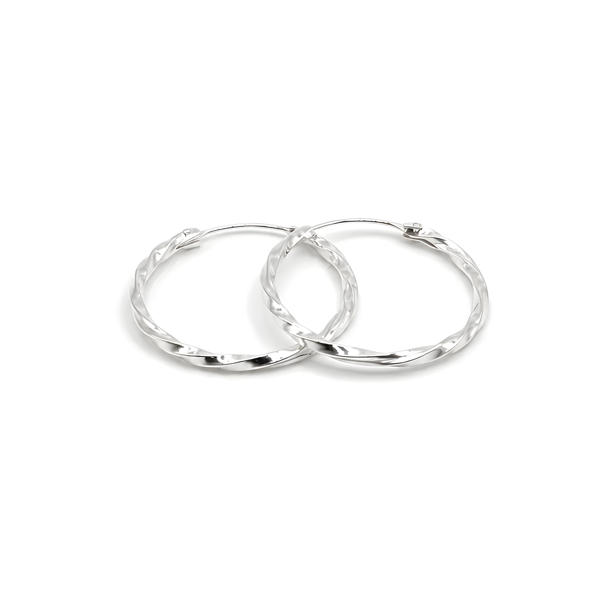 A pair of sterling silver hoop earrings with a textured, hammered finish.