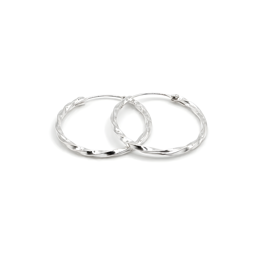 A pair of sterling silver hoop earrings with a textured, hammered finish.