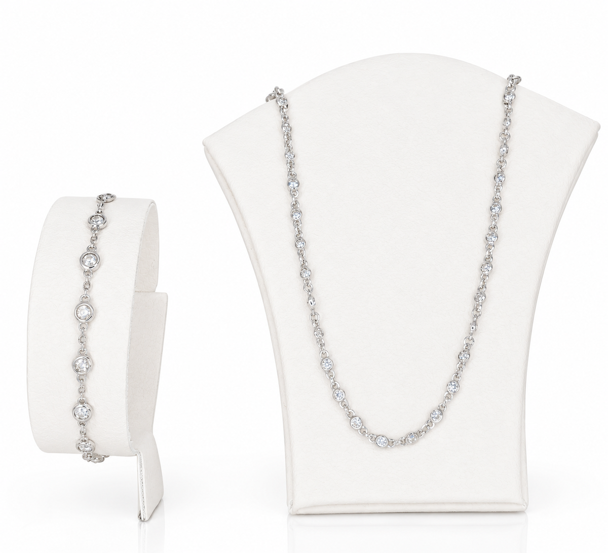 A sterling silver jewellery necklace set, featuring round shaped cubic zirconia in a necklace and bracelet.